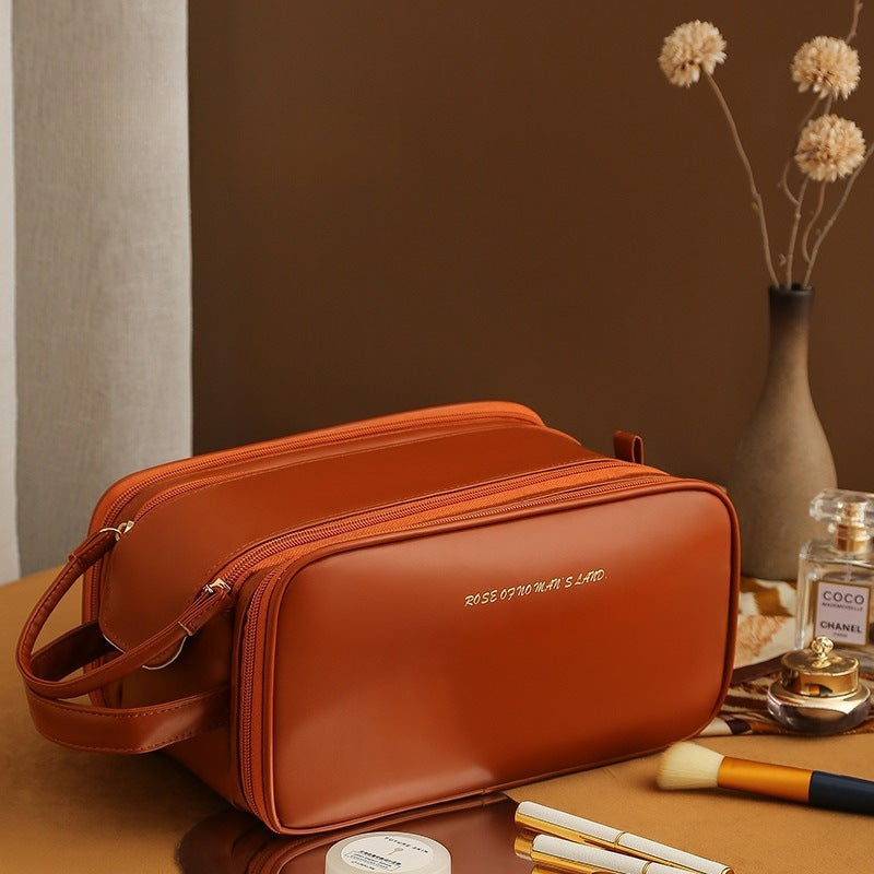 Expandable waterproof cosmetic storage bag in white, black, pink, or brown